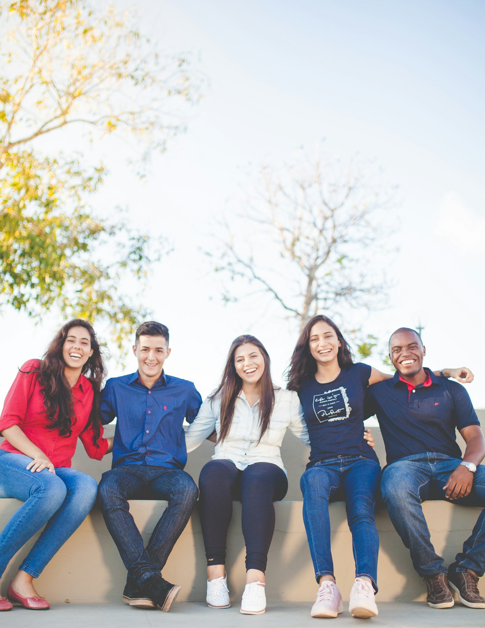 A diverse group of people smiling together